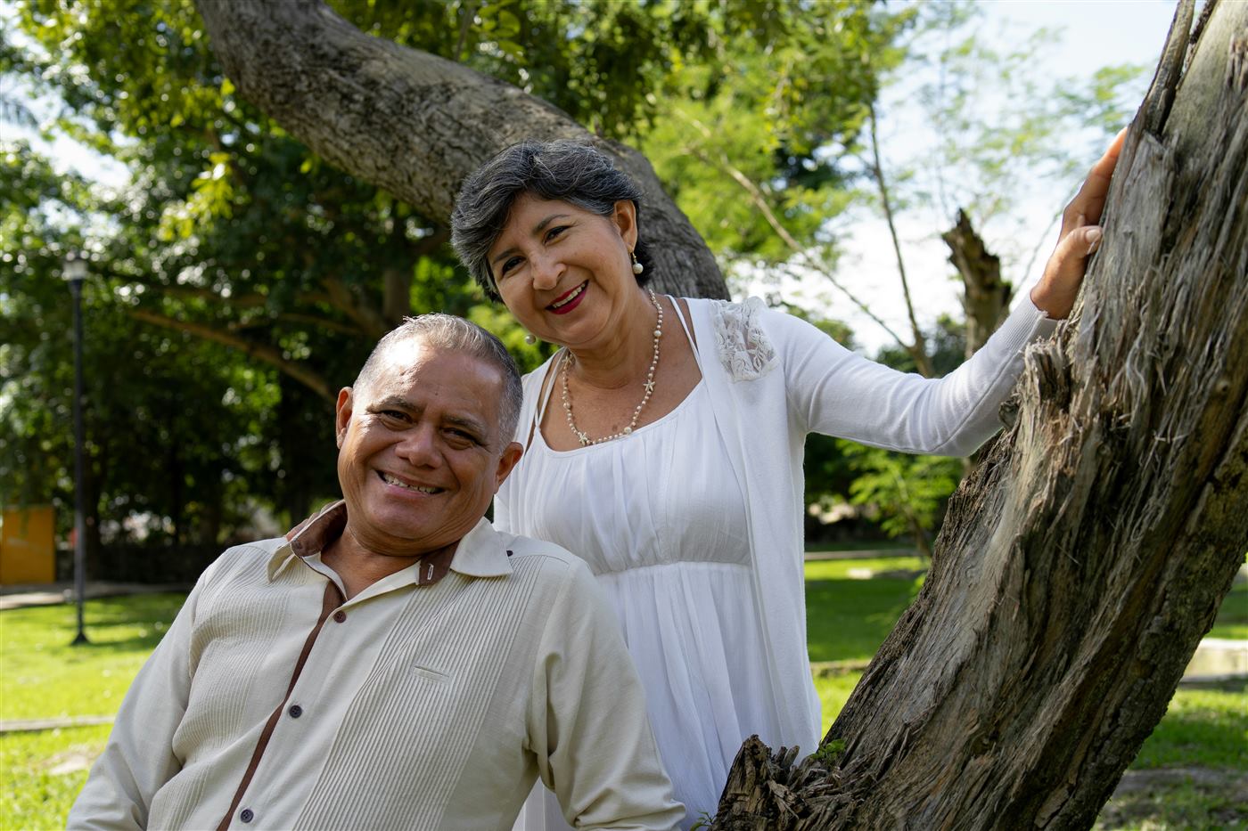 A senior couple smiling together outdoors